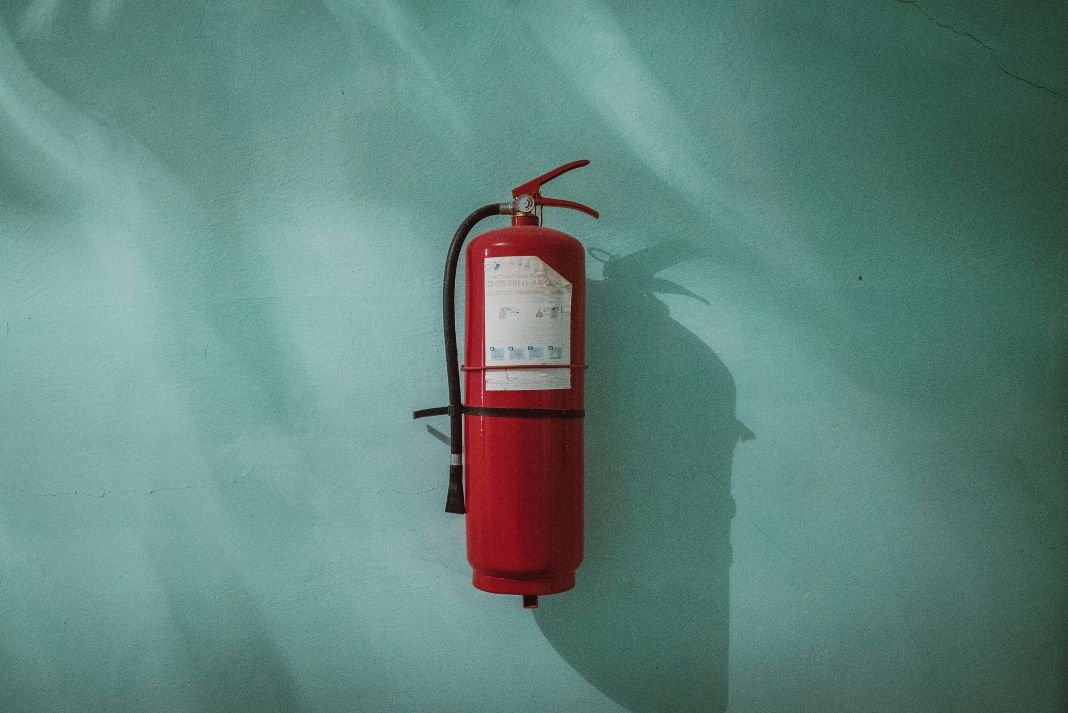 A photo of a fire extinguisher on a wall