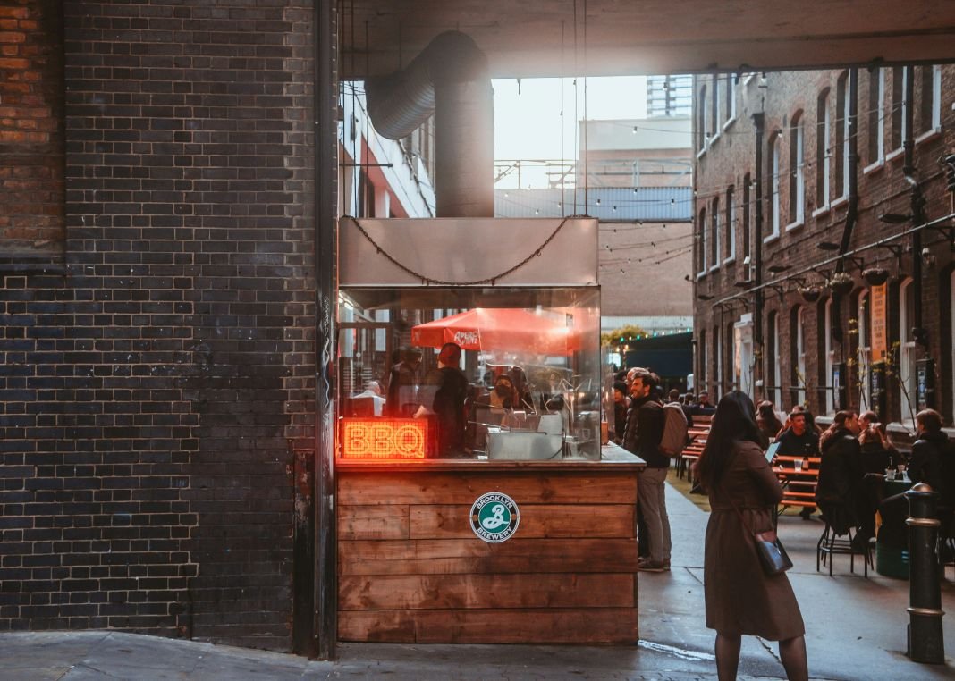A photo of a food stall selling bbq food in london