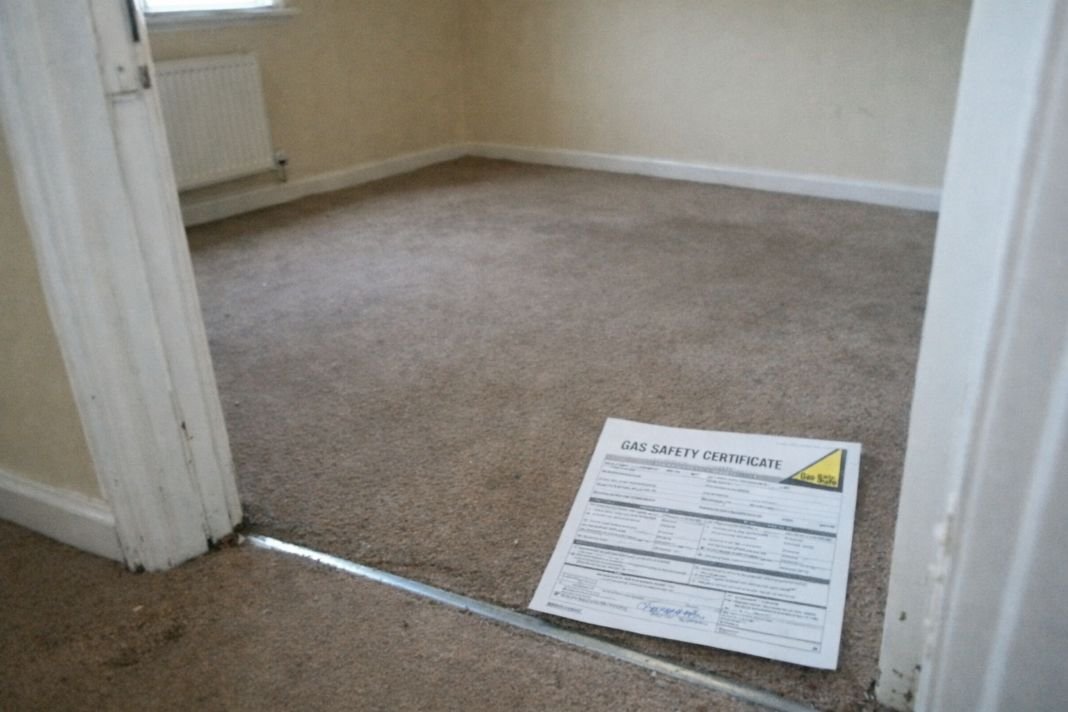 an ai photo of an empty rental property room with a printed safety certificate lying on the floor near the doorway,